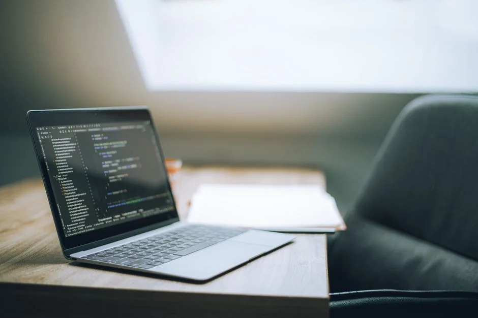 A contemporary workspace showcasing a laptop, tablet, and smartphones, ideal for tech and freelance use.